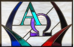 Stained glass window showing Alpha and Omega symbols