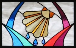 Stained glass window with baptismal shell and water