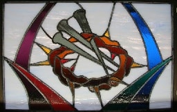 Stained glass window with crown of thorns and nails