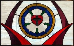 Stained glass window depicting Luther's Rose seal